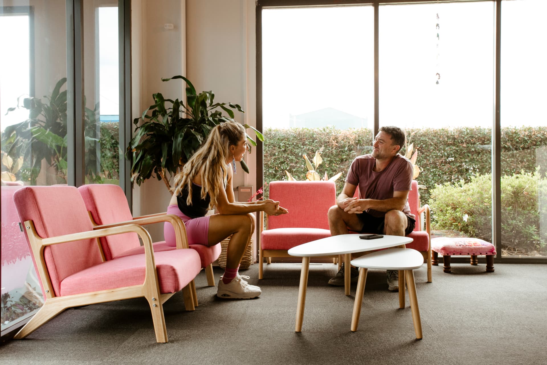 Lani chatting with a client in The Pilates Jeanie studio lounge